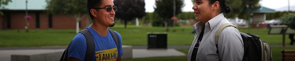 Two male students talking outside