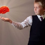 Boy with floating brain in hand